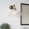 Langley Fluted Bathroom Wall Light with Byron Arm  in Antiqued Brass