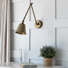 Club Articulated Wall Light in Antiqued Brass