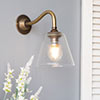 Newton Fine Fluted Wall Light with Carrick Arm in Antiqued Brass