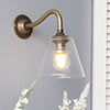 Newton Fine Fluted Wall Light with Carrick Arm in Antiqued Brass