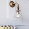 Newton Fluted Wall Light with Brooke Arm in Antiqued Brass