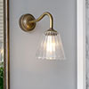 Newton Fluted Bathroom Wall Light with Byron Arm in Antiqued Brass