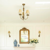 Single Fleur Wall Light in Antiqued Brass