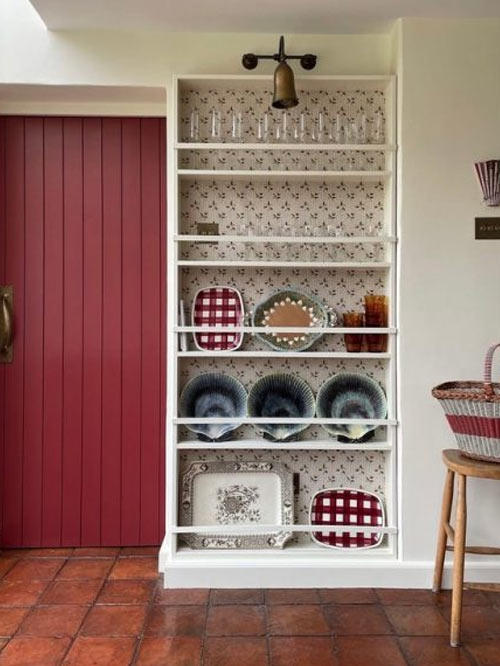 Red kitchen with Single Howard wall light