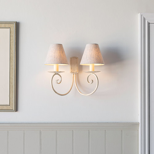 Scrolled wall light in old ivory